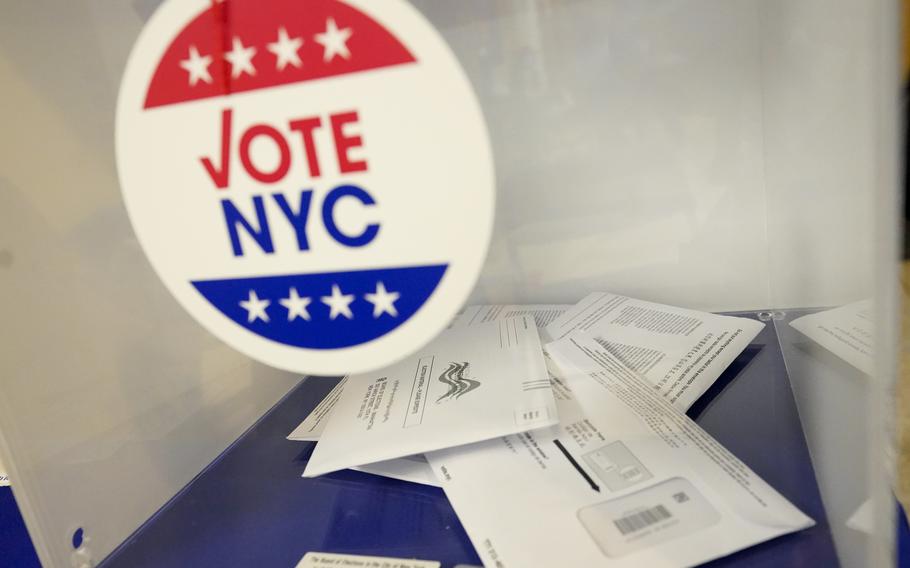 Absentee ballots sit in a ballot box during early voting in the primary election, Monday, June 14, 2021, at the Church of St. Anthony of Padua in the Soho neighborhood of New York.