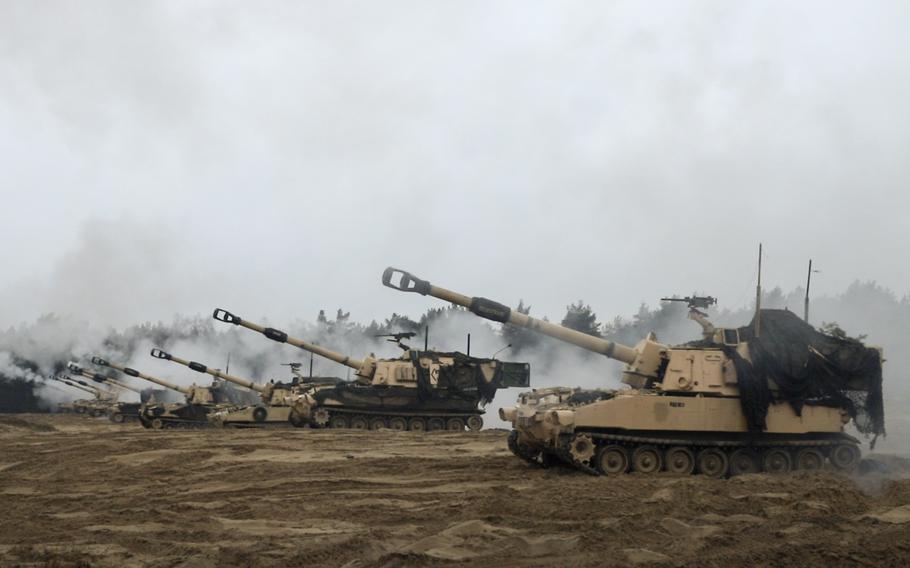 U.S. Army M109 Paladins take part in a training mission in Torun, Poland, Feb. 22, 2024. A Center for Strategic and International Studies report released Monday recommends the permanent presence of an American armored brigade in Poland to bolster NATO's eastern flank.