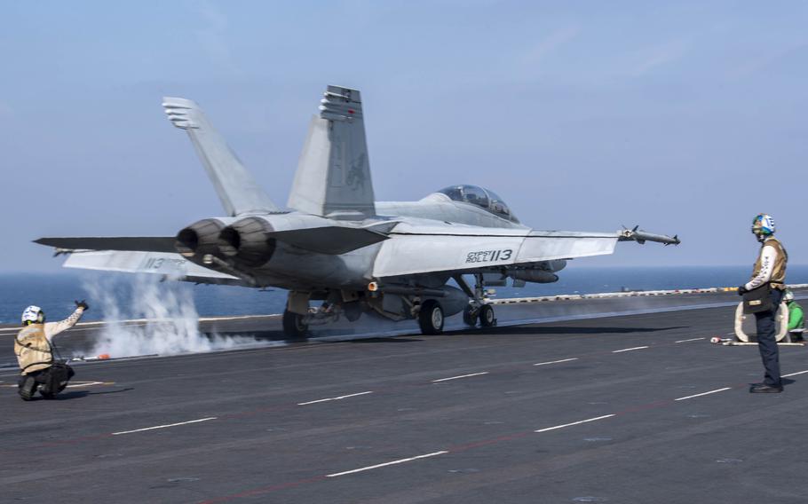 An F/A-18F Super Hornet fighter jet takes off from the aircraft carrier USS Dwight D. Eisenhower in the Persian Gulf on Dec. 1, 2023. The Eisenhower and its carrier strike group are deployed to the U.S. 5th Fleet area of operations.