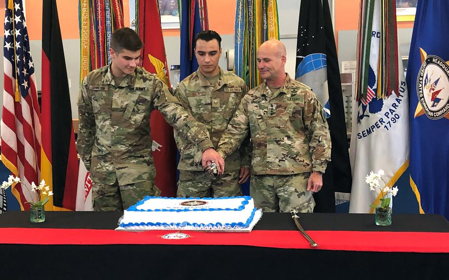 Gen. Christopher Cavoli, right, along with two U.S. European Command troops, cuts a cake Monday during a ceremony at Patch Barracks in Stuttgart that marked the command’s 70th anniversary. 