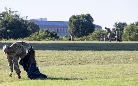 National Guardsmen pick up debris Tuesday, Aug. 26, 2025 in Washington at the Washington Monument. (Eric Kayne/Stars and Stripes)