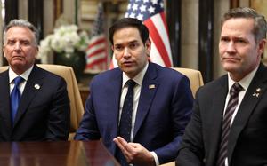 Steve Witkoff, Marco Rubio and Mike Waltz seated at a table, with Rubio appearing to be mid-sentence and gesturing.