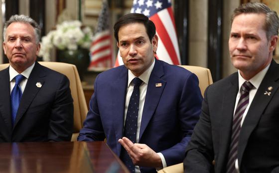 Steve Witkoff, Marco Rubio and Mike Waltz seated at a table, with Rubio appearing to be mid-sentence and gesturing.