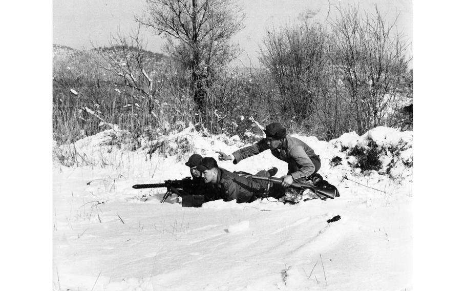 Soldiers aim their weapons during an exercise.