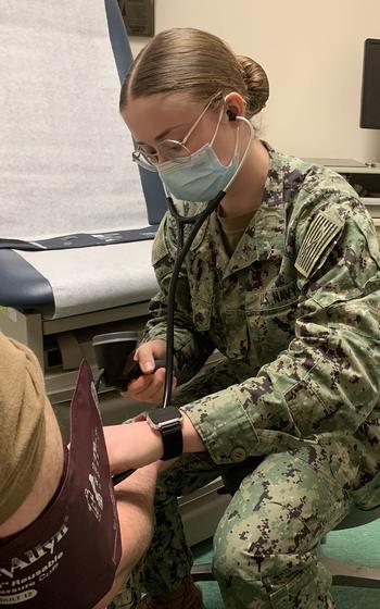 Seaman Apprentice Krista Fitch takes the blood pressure of a sailor at the active-duty medical clinic at Naval Support Activity Naples, Italy, on April 20, 2023. High and elevated blood pressure are among the top diagnoses at the clinic, officials say.