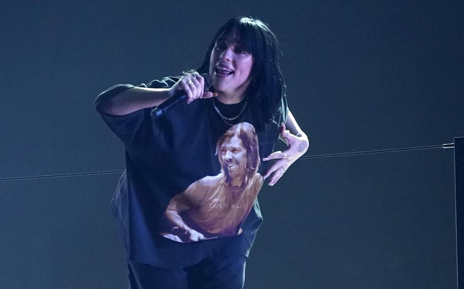 The late Foo Fighters drummer Taylor Hawkins appears on the shirt of Billie Eilish as she performs “Happier Than Ever” at the 64th Annual Grammy Awards on Sunday, April 3, 2022, in Las Vegas. 