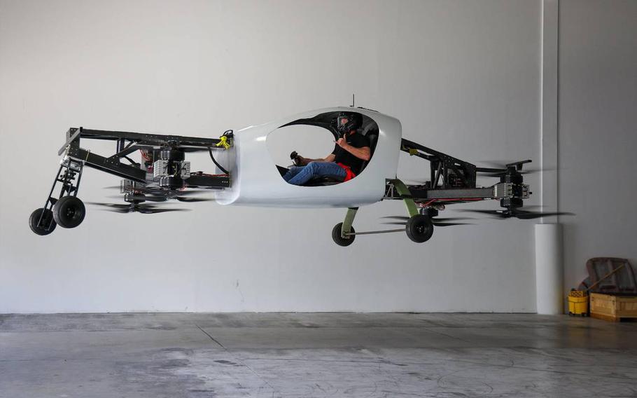 Doroni Aerospace CEO Doron Merdinger gives a thumbs up as he levitates in the latest version of his company’s flying car at Doroni Aerospace’s Pompano Beach offices, Monday, July 3, 2023. 