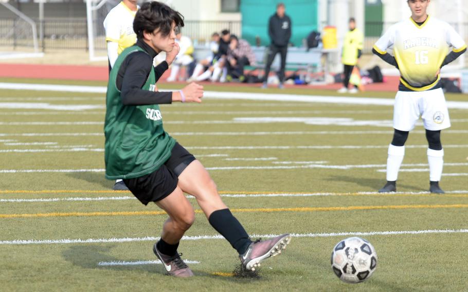 Kubasaki's Frank Stare lets fly his match-winning penalty kick during Saturday's Perry Cup Gold Group match. The Dragons won 2-1 over Kadena, which ended up winning the group and the championship via goal differential.