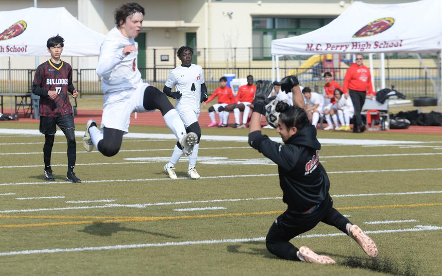 E.J. King’s NJ Reed is stopped by Marist Brothers International goalkeeper Sehej Chadha during Friday’s Perry Cup boys soccer match. The Bulldogs won 1-0.