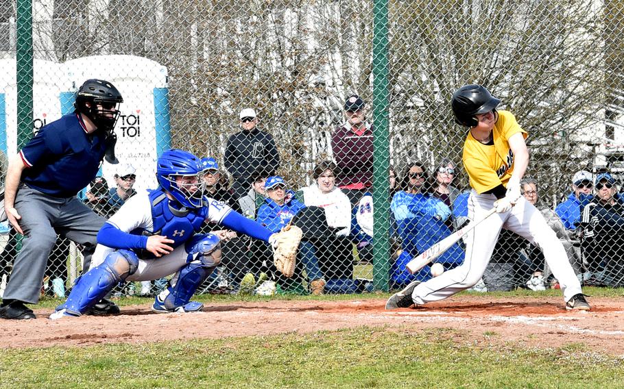 Stuttgart's Blake Rossignol swings during the second game of a doubleheader Saturday against Ramstein at the baseball field near Southside Fitness Center on Ramstein Air Base, Germany. Catching for the Royals is Chuck Wheeler.