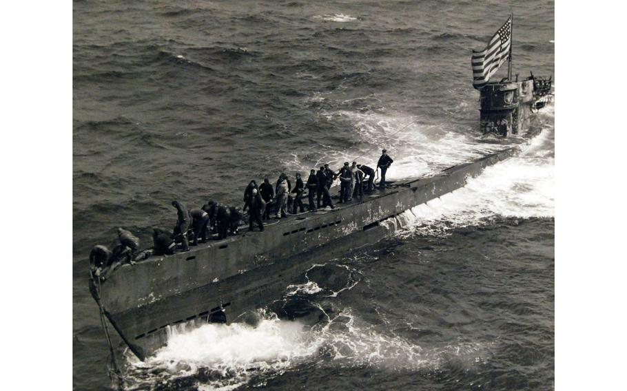 The capture of German submarine U-505, June 4, 1944. Members of the boarding party from USS Pillsbury (DE 133) secure the tow-line to the bow of the captured German submarine, U-505. “Grounded” writer George Brant’s grandfather, Robert Alexander, was in the Navy and part of the group that captured the U-505, Brant said.