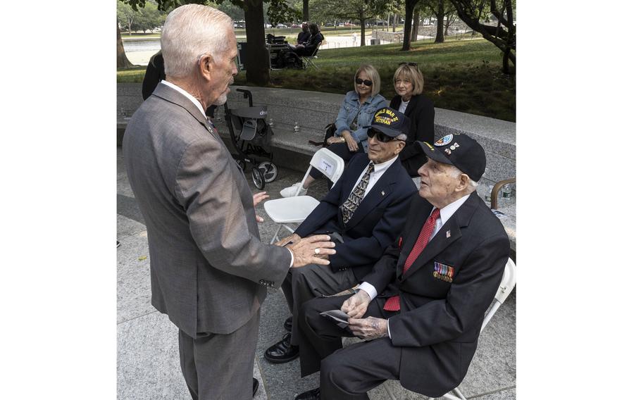 Rep. Bill Johnson, R-Ohio, talks with veterans Frank Cohn and Lincoln Harner the National World War II Memorial in Washington, D.C., on the 79th anniversary of the start of the D-Day invasion, Tuesday, June 6, 2023.