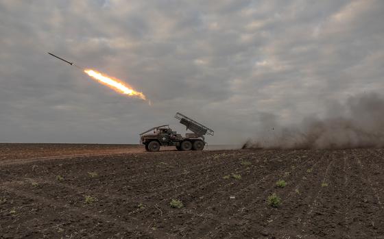 Ukrainian servicemen of the 92nd Assault Brigade fire BM-21 'Grad' multiple rocket launcher toward Russian positions, in the Kharkiv region, on May 15, 2024, amid the Russian invasion of Ukraine. (Roman Pilipey/AFP/Getty Images/TNS)