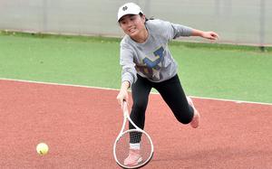 Ansbach's Meredith Maxwell stretches for a ball during a match against Kaiserslautern's Abby Hover on Sept. 23, 2023, at Kaiserslautern High School in Germany. 