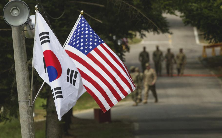 The South Korean and U.S. flags fly next to each other at Yongin, South Korea, Aug. 23, 2016. 