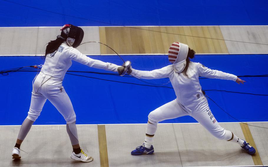 Amanda Pirkowski, a U.S. women’s Olympic fencing team cadet athlete, spars with Olympian Isis Washington at Lotus Culture Center Arena, part of the Atago Sports Complex, in Iwakuni, Japan, July 14, 2021. 