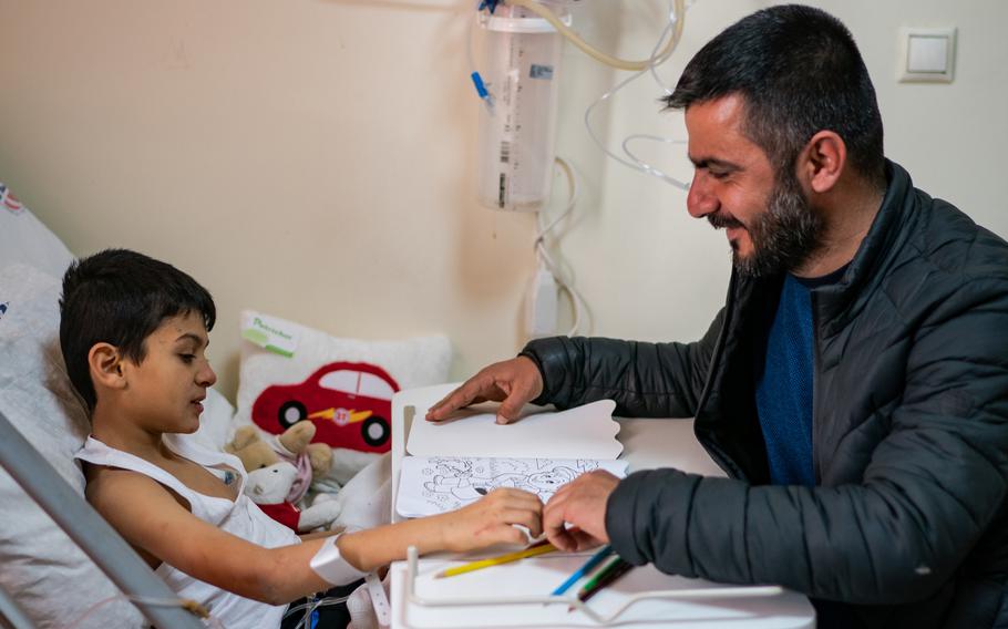 A 9-year-old recovers in a hospital in Gaziantep, Turkey, on Monday. The boy's parents are dead, but relatives were waiting a bit to tell him.