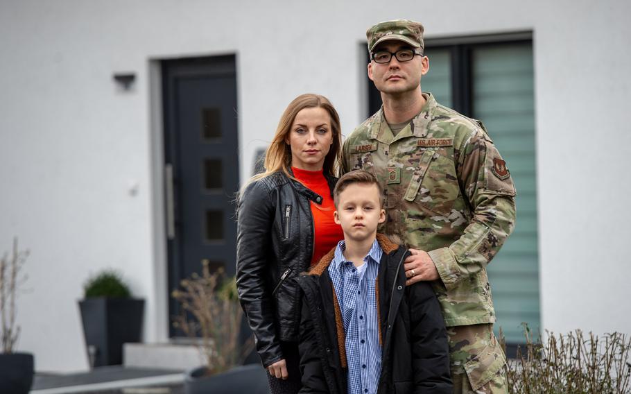 Master Sgt. Matthew Larsen, wife Kathrin and son Jayden stand in front of their house in Reichweiler, Germany, March 11, 2020. German tax collectors have fined Larsen, a recently retired U.S. airman living in Florida, for not filing German income taxes on his military pay. 