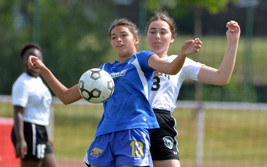 Sigonella’s Ryleigh Denton protects the ball from AFNORTH’s Paula Bohlen in the girls Division III final at the DODEA-Europe soccer championships in Kaiserslautern, Germany, Thursday, May 19, 2022. Sigonella beat the Lions 3-1.
