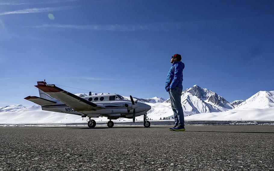 Thomas Painter, co-founder of Airborne Snow Observatories, stands on the tarmac near one of the planes used to fly over the mountains to collect detailed data about the snowpack at Mammoth Yosemite Airport.