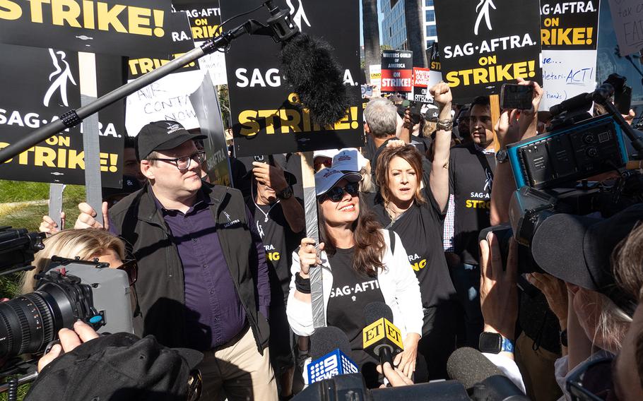 SAG-AFTRA President Fran Drescher and National Executive Director and Chief Negotiator Duncan Crabtree-Ireland, left, greet picketers at the Netflix picket line in Los Angeles on July 14, 2023. 