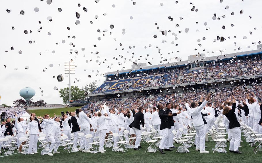 U.S. Navy ensigns and Marine Corps second lieutenants of the U.S. Naval Academy’s Class of 2022 toss their covers at the conclusion of the graduation and commissioning ceremony at Navy-Marine Corps Memorial Stadium on May 27, 2022. 