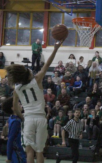 Alconbury's Alfonso Sanchez goes for a finger-roll layup after stealing the ball and going on a break away agianst Brussels on Friday, Jan. 20, 2023 at RAF Alconbury, England.