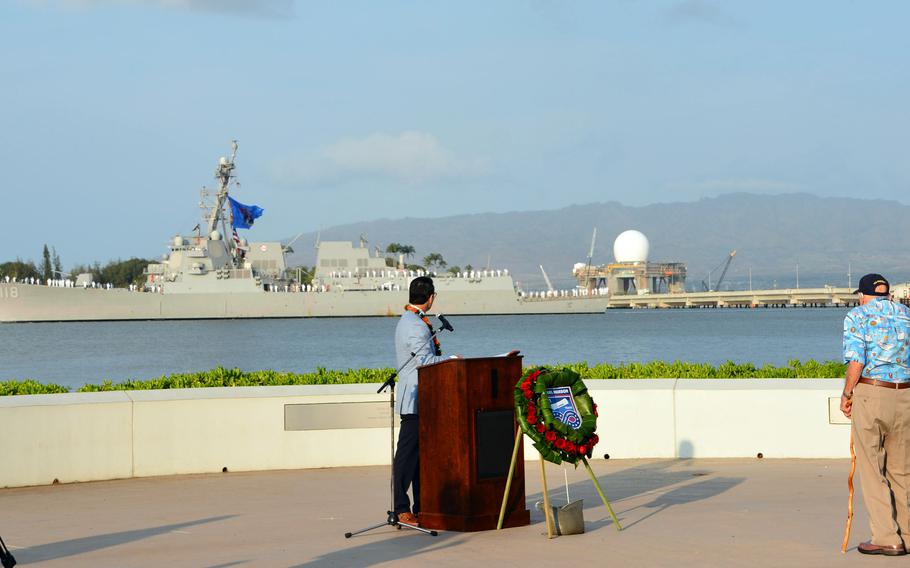 Kenneth Stevens, a 100-year-old Pearl Harbor survivor, salutes the USS Daniel Inouye, Dec. 7, 2022, during a ceremony at the Pearl Harbor National Memorial commemorating the 81st anniversary of the surprise attack.