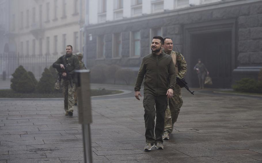 Ukrainian President Volodymyr Zelenskyy, center, walks in Kyiv, Ukraine, on April 1, 2022.