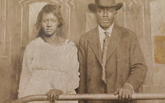 Sheeka Sanahori’s great-grandmother Viola Mays and an unnamed man in a postcard photo. Sanahori visited the spot this photo was likely taken, at the National Park Service’s museum in St. Louis, while retracing her ancestors’ Great Migration journey. 