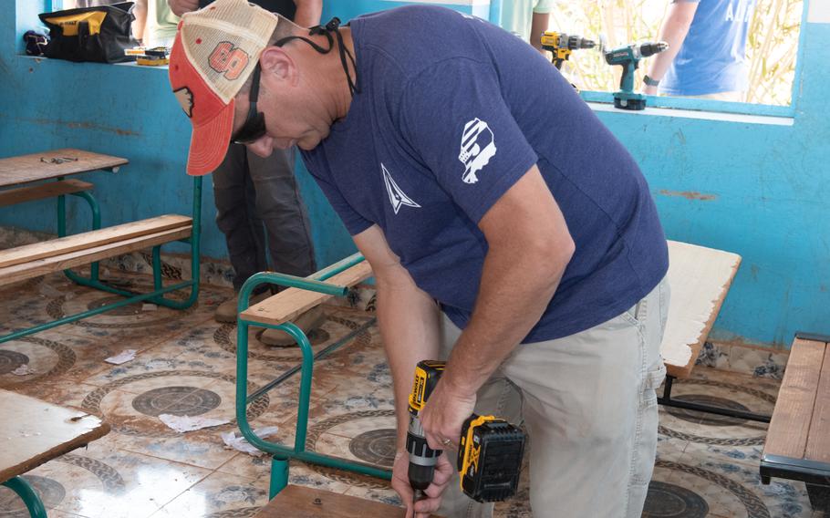 U.S. service members deployed to Camp Lemonnier repaired desks and delivered picnic tables in support of the 450th Civil Affairs Battalion renovation project at a primary school in Ali Oune, Djibouti, June 7, 2023.