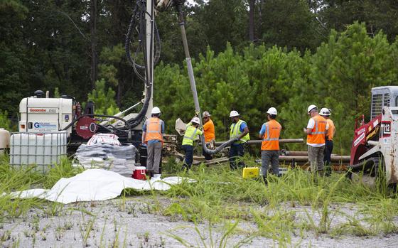Navy Contractors use a sonic drill to install a groundwater monitoring well to gather soil and groundwater samples to be tested for Per- and Polyfluoroalkyl Substances (PFAS) on Marine Corps Base Camp Lejeune, North Carolina, Aug. 19, 2020. PFAS are man-made chemicals commonly used for clothing, food packaging and carpeting and have the potential to be toxic.  Frequent testing is done to ensure drinking water on MCB Camp Lejeune and MCAS New River is safe. (U.S. Marine Corps photo by Lance Cpl. Christian Ayers)