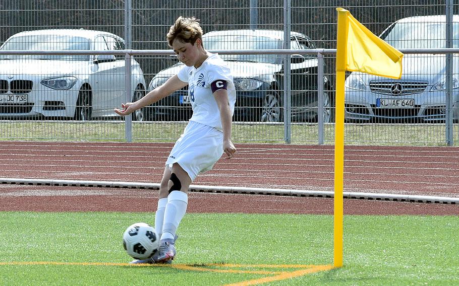 Wiesbaden senior captain McKinley Viers hits a corner during the second half of the Warriors' match against the Royals on Saturday at Ramstein High School on Ramstein Air Base, Germany.