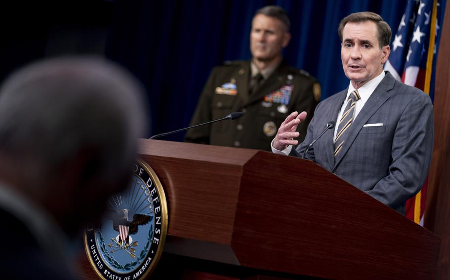 Pentagon spokesman John Kirby, accompanied by Army Major Gen. William Taylor, left, speaks during a news briefing at the Pentagon on Friday, Aug. 20, 2021. 