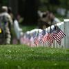 U.S. flags are placed in front of every grave site ahead of Memorial Day weekend in Arlington National Cemetery on May 21, 2020, in Arlington, Virginia. Army Pfc. David Owens, killed in action during World War II, will be buried at Arlington National Cemetery. 