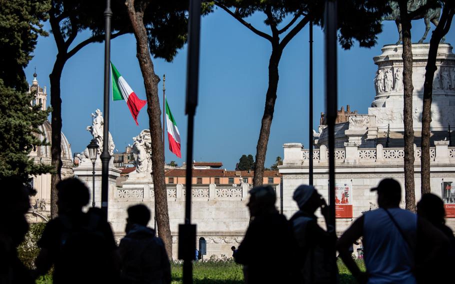 The Italian national flag flies near a monument to the unknown soldier in Rome on Oct. 20, 2018.