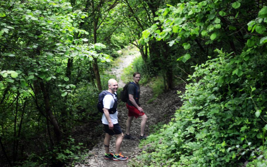 Joshua Seaman and Matthew McNeil, U.S. soldiers based in Germany, hike down part of the RheinBurgenWeg near Bad Salzig, Germany, June 5, 2021. The trail stretches 120 miles along the Rhine River but can be tackled in shorter stages.