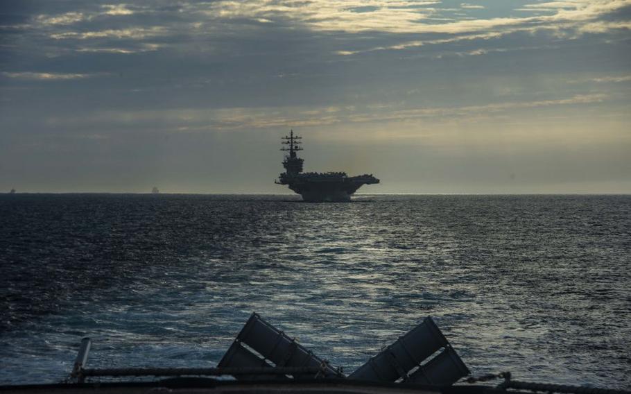 The USS Dwight D. Eisenhower (CVN 69) transits the Strait of Gibraltar, July 7, 2021 on its way back to Norfolk after its second deployment in a year. (U.S. Navy photo by Petty Officer 2nd Class Dean M. Cates)