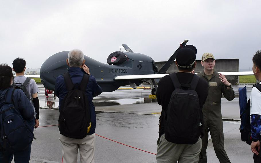 Vistors check out an Air Force RQ-4 Global Hawk surveillance drone during the 47th annual Japanese-American Friendship Festival at Yokota Air Base, Japan, May 20, 2023. 