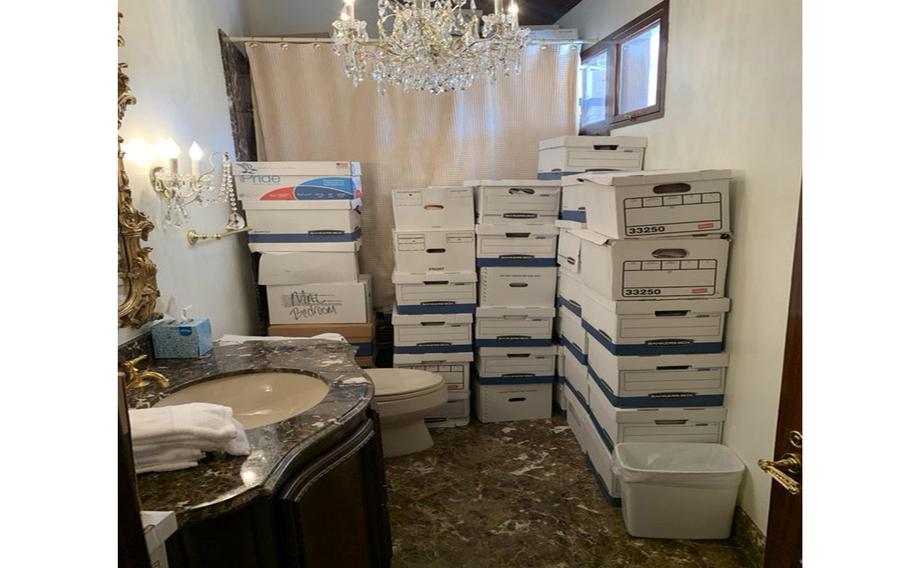 This image, contained in the indictment against former President Donald Trump, shows boxes of records stored in a bathroom and shower in the Lake Room at Trump’s Mar-a-Lago estate in Palm Beach, Fla. 