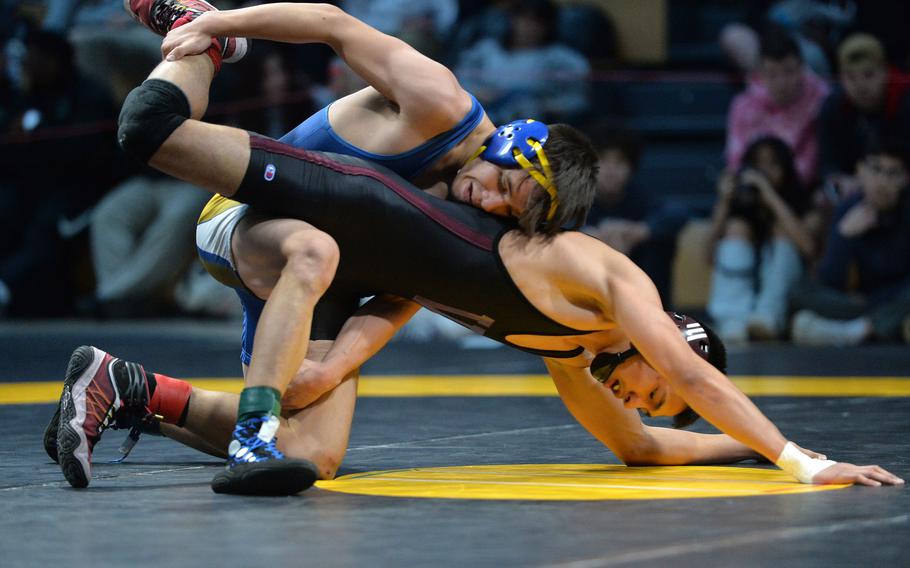 Wiesbaden’s Munro Davis took the 120-pound crown, defeating Vilseck’s Jude Cruz at the DODEA-Europe wrestling championships, in Wiesbaden, Germany, Feb. 11, 2023.