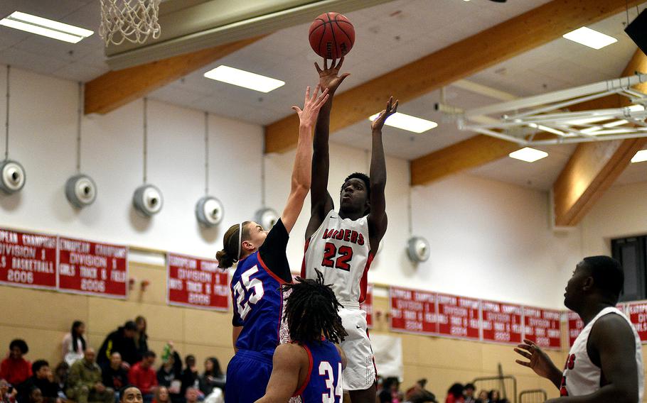 Kaiserslautern's Uray Dukuly shoots over Ramstein's Kelan Vaughn during a Jan. 31, 2024, game at Kaiserslautern High School in Kaiserslautern, Germany.