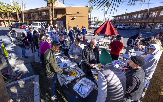 Hebron tenants are served a Thanksgiving meal there by community volunteers and Caridad Board members on Thursday, Nov. 24, 2022, in Las Vegas.