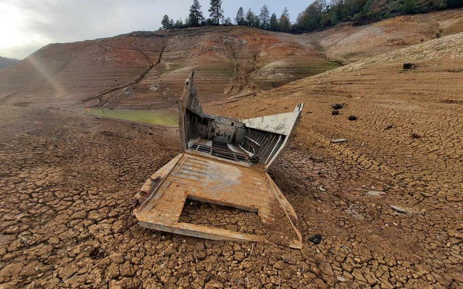 A boat from the USS Monrovia emerged from the shores of Lake Shasta as the California drought continued in October.
