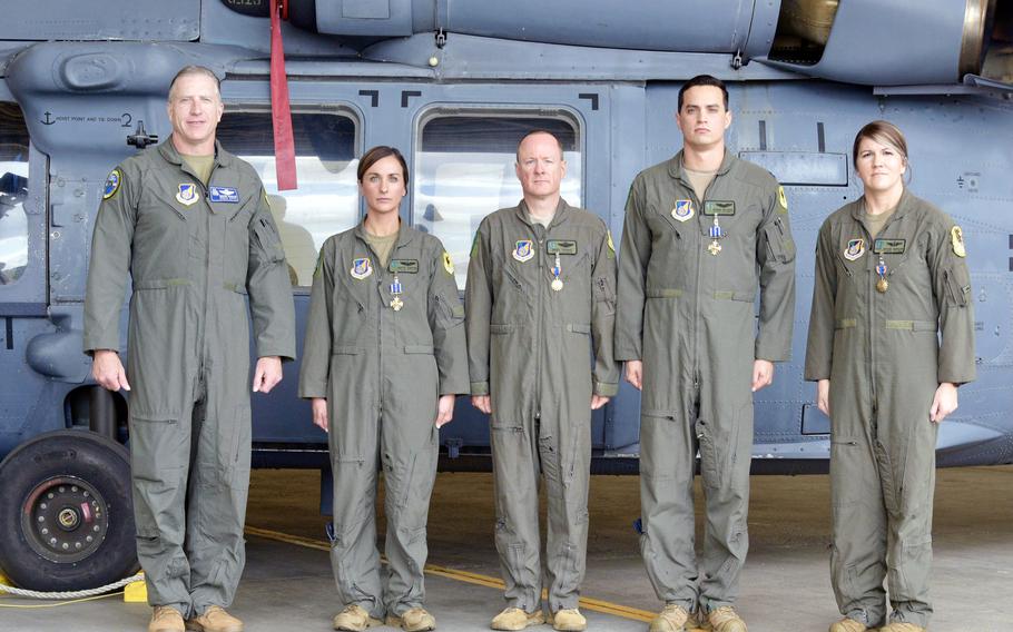Brig. Gen. David Eaglin, commander of the 18th Wing, far left, poses with Maj. Grace Gibbens, left to right, Maj. Andrew Travis, Capt. Anthony Delgado and Tech. Sgt. Shelby Duncan at Kadena Air Base, Okinawa, Feb. 8, 2023.