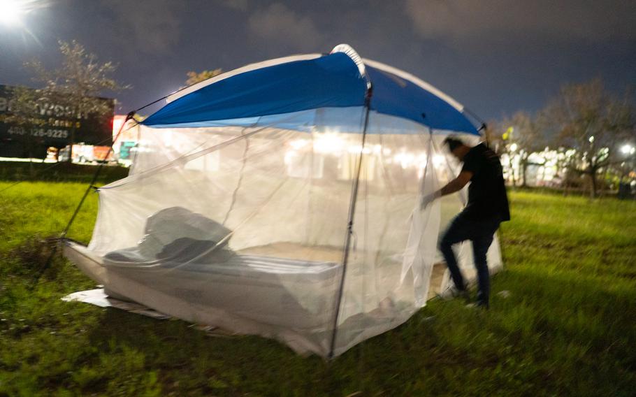 Heber, 32, an immigrant from Honduras, traveled from Austin, Texas, to Florida for work with two friends. They spent some nights sleeping in a tent in the Home Depot parking lot as they looked for work.