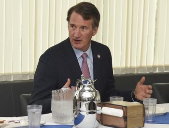 Virginia Gov. Glenn Youngkin chats with service members over breakfast at the Samurai Cafe on Yokota Air Base, Japan, Wednesday, April 26, 2023.