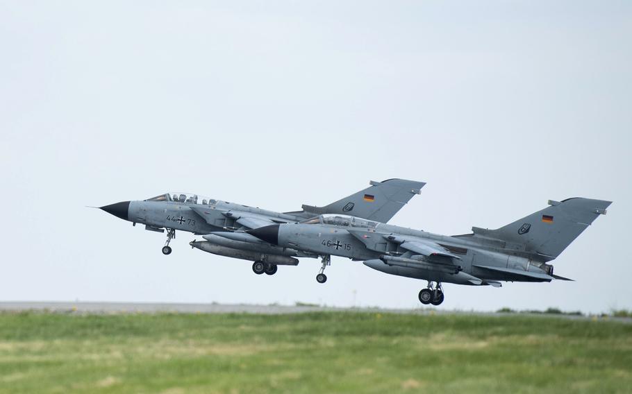 Two German air force Tornadoes take off at Buechel Air Base in Germany on May 7, 2022. About 20 U.S. nuclear warheads are believed to be stored at the base. The Heritage Foundation said in a report issued last week that some U.S. nuclear bombs positioned in Europe should be relocated to Poland.