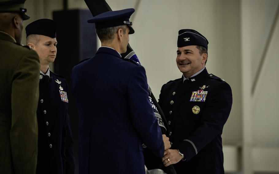U.S. Space Force Col. Max Lantz, right, accepts the unit flag from U.S. Air Force Lt. Gen. Steven Basham, during the U.S. Space Forces Europe and Africa activation ceremony Dec. 8, 2023, at Ramstein Air Base, Germany. The symbolic transfer of the flag from Basham to Lantz represents the formal handover of responsibility for the space component in Europe.