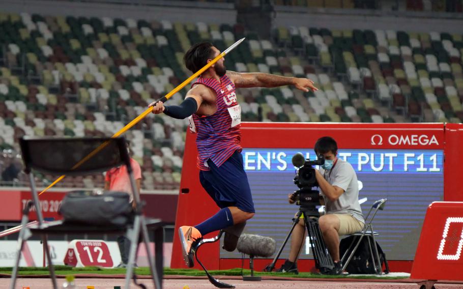 Paralympian Mike Gallardo, an Army veteran who lost a leg to a pair of roadside bombs in Iraq, throws his javelin at National Stadium in Tokyo, Monday, Aug. 30, 2021. 